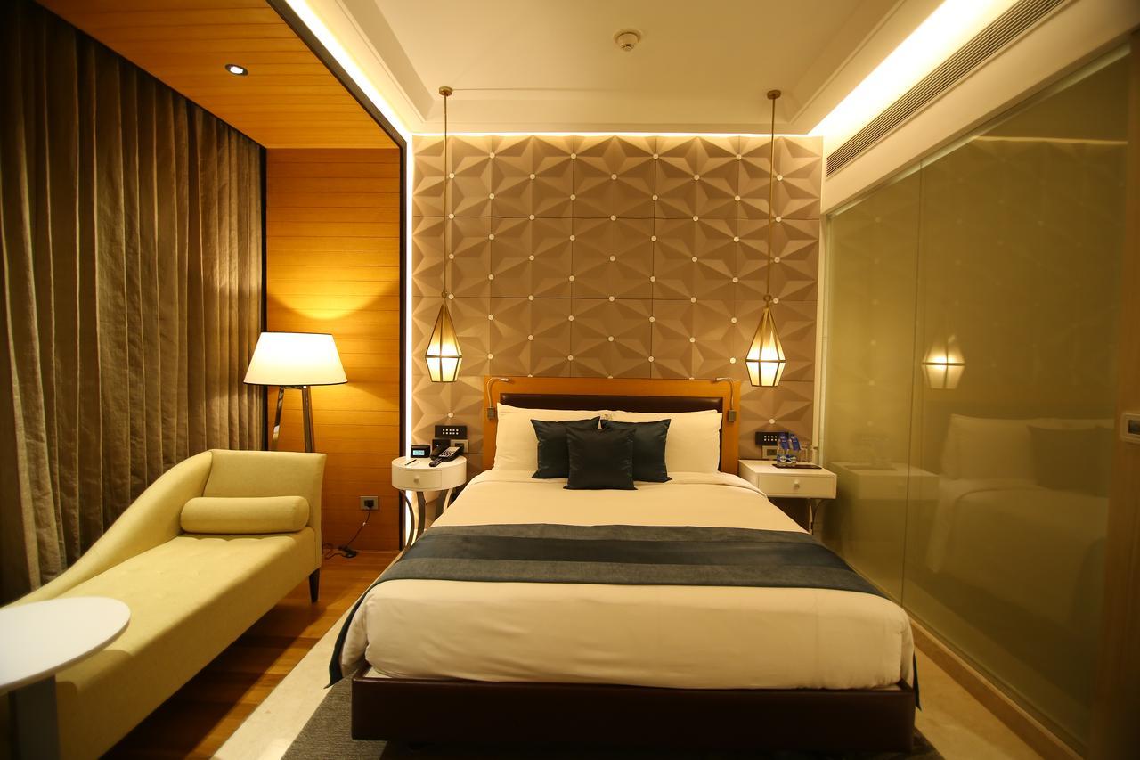 Radisson Blu Coimbatore Exteriör bild A room at the hotel